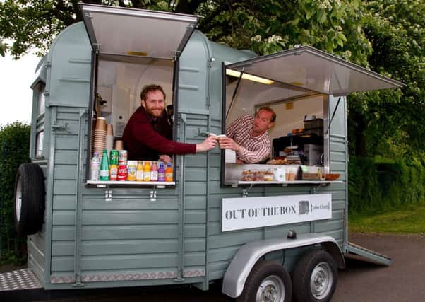 Jamie Maclean, left, and Ben Gillespie of Out Of The Box coffee and events in their trailer at Inverleith Park. Picture: Scott Louden