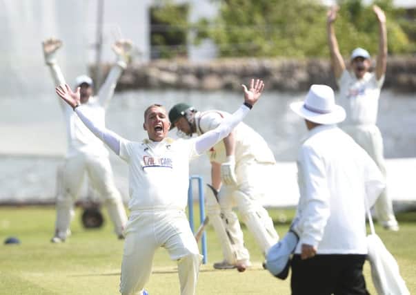 Carlton celebrate taking the wicket of Watsonians batsman Andrew Learmonth at Grange Loan. Pic: Greg Macvean