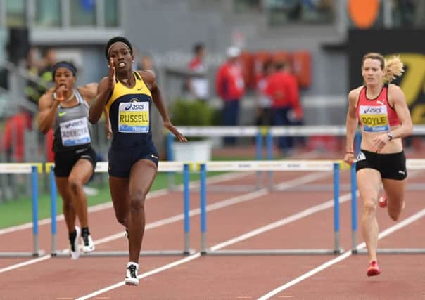 Eilidh Doyle, right, finished her 400m hurdle race in Birmingham in a morale-boosting 54.47 seconds
