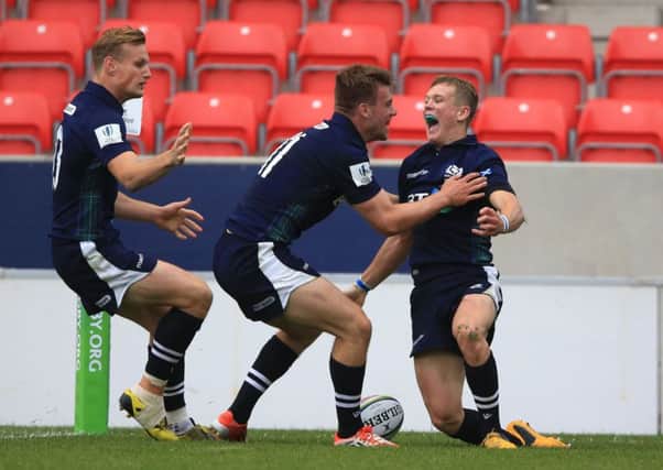 Scotland's Darcy Graham, right, celebrates after scoring what turned out to be the winning try against Australia at the Under-20 World Championship at the AJ Bell Stadium in Salford. Picture: Nigel French/PA Wire