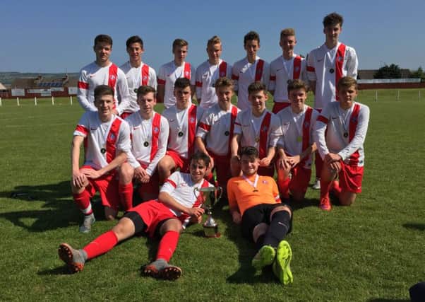 Spartans Reds 17s relax after clinching yet another piece of silverware