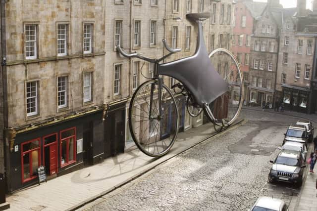 An outsized carbon fibre racing bicycle perched outside the Bow Bar. Picture: supplied