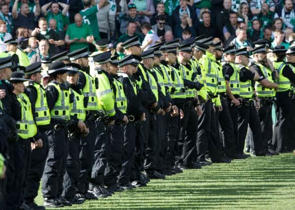 Police line the pitch during the Scottish Cup Final at Hampden.  Picture Robert Perry