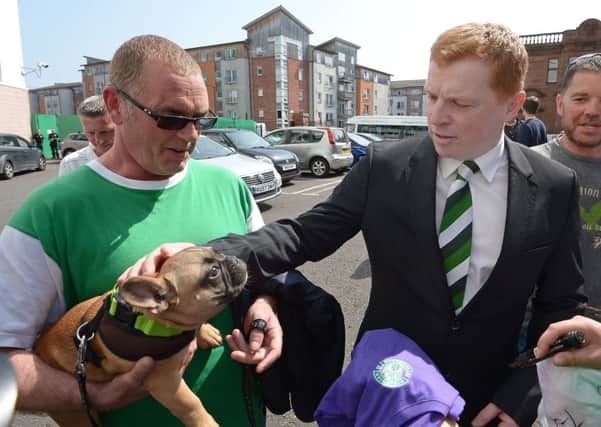 Neil Lennon was greeted by a fans dog. Picture: Neil Hanna