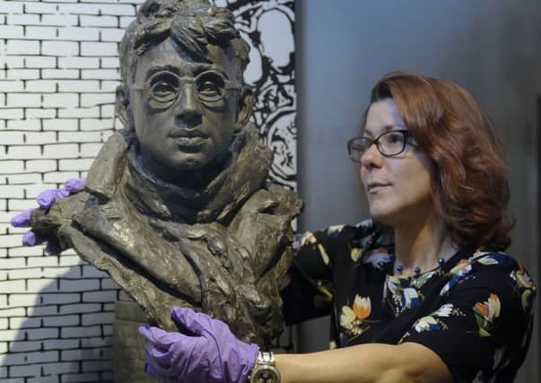 Imogen Gibbon, deputy director of the Scottish National Portrait Gallery, admiring the bust of Jack Coia by Archibald Dawson. Picture: Neil Hanna