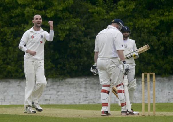 Andy McKay, left, takes 9 wickets for 9 runs off 6.2 overs as Watsonians see off rivals Mazars Grange. Pic: TSPL