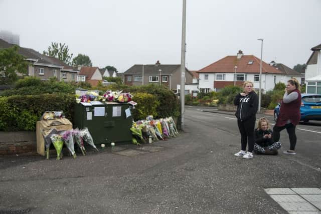 People leave tributes near the crash site. Picture: Andrew O'Brien
