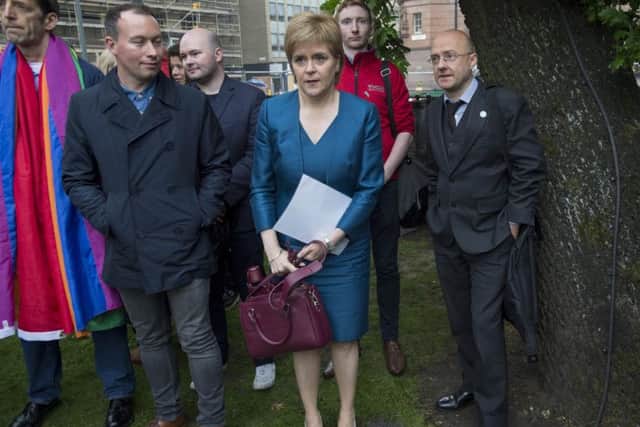 First Minister Nicola Sturgeon and Scottish Greens leader Patrick Harvie during the vigil. Picture: Ian Rutherford
