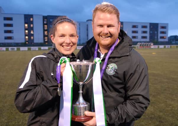ibs Ladies manager Chris Roberts and his assistant Claire Ditchburn show off the League Cup