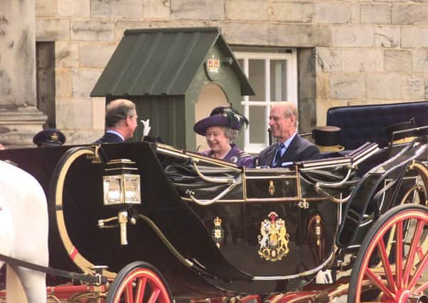 The Queen and Duke of Edinburgh leave the Palace of Holyroodhouse for the first opening of the parliament in 1999. Picture: Bill Henry