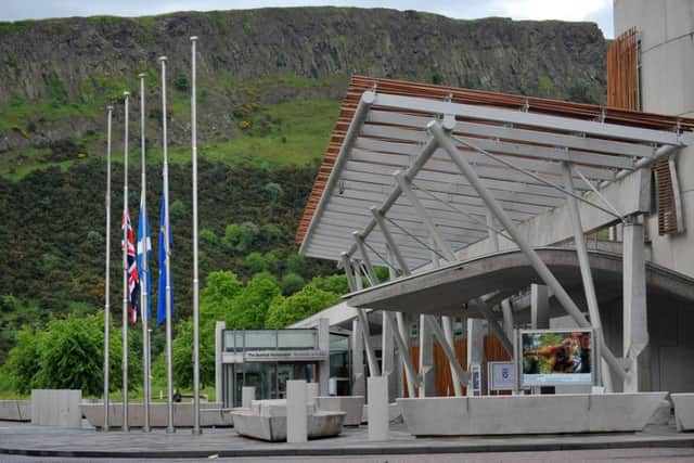 Flags at half mast outside Scottish Parliament . Picture: PA