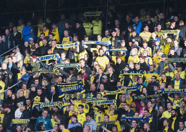 Brondby fans, bedecked in their traditional blue and yellow. Pic: Getty