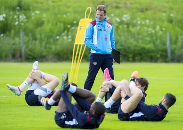 Robbie Neilson puts his Hearts players through their paces at their pre-season training base at St Andrews. Pic: SNS