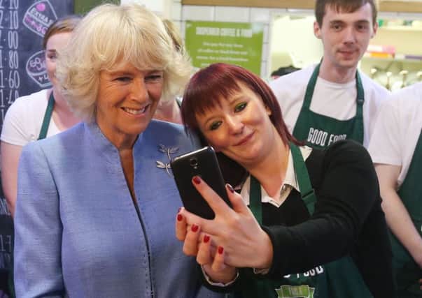 Duchess of Rothesay has a selfie taken with employee Biffy Mackay (right), during a visit to Social Bite. Picture: Andrew Milligan/PA Wire