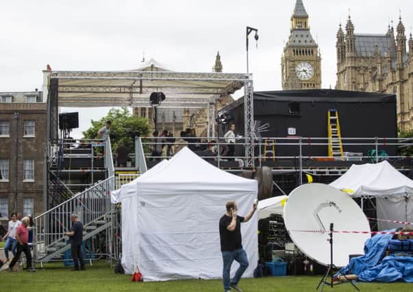 Media prepare around their tents on Abingdon Green outside the Houses of Parliament. Picture: Getty