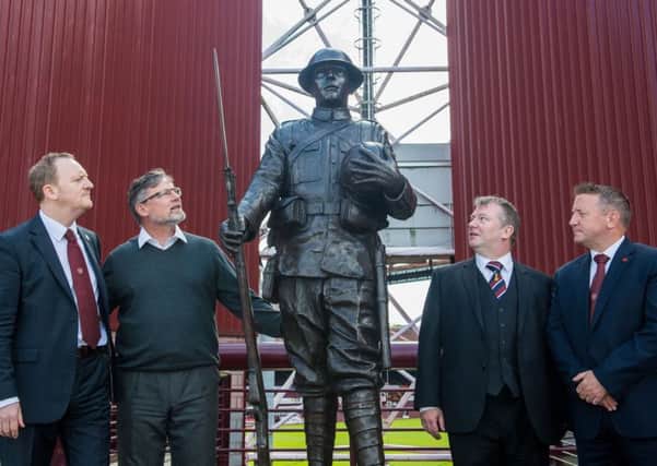 Hearts' chief operating officer Scot Gardiner, director of football Craig Levein, Gordon Angus, chairman of the 1914 Trust committee and club legend John Robertson attended the unveiling of the statue at Tynecastle. Pic: Ian Georgeson