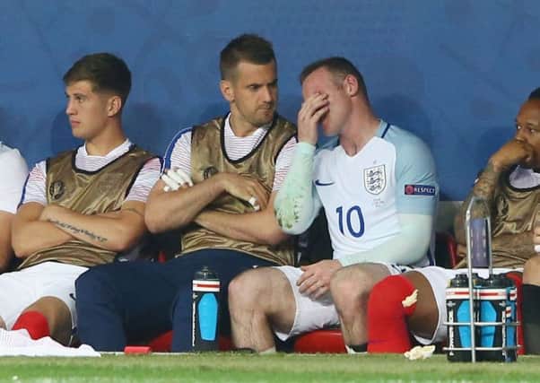 Wayne Rooney shows his frustration on the bench after being replaced during the match between England and Iceland. Picture: Getty Images