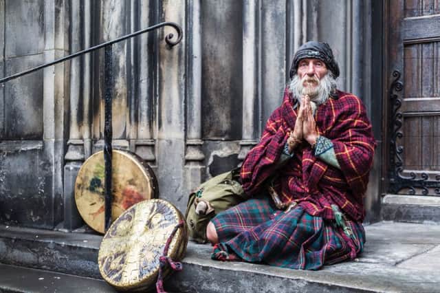 'I met this character on a rain-soaked day on the side steps of St Giles Cathedral. He was spending the day in Edinburgh before making his way to the Isle of Eigg, where he was going to spend a month living in a cave!' Picture: Rory Cavanagh