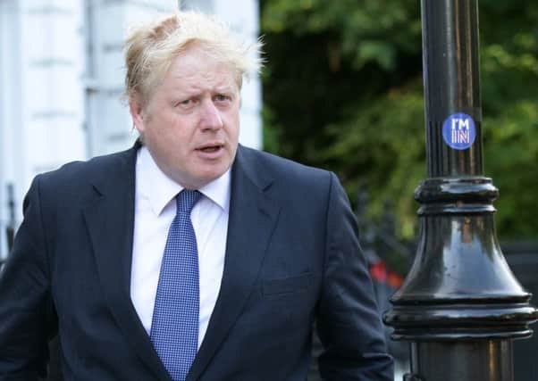 Far from celebrating, Boris Johnson seems downcast. Picture: Yui Mok/PA Wire