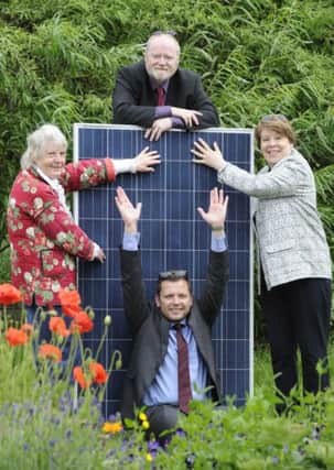 Edinburgh Solar Co-operative board member Johanna Carrie, chair Richard Dixon, city environment convener Councillor Lesley Hinds  and Chris Clark from solar panels supplier Emtec Energy launch the scheme. Picture: Colin Hattersley