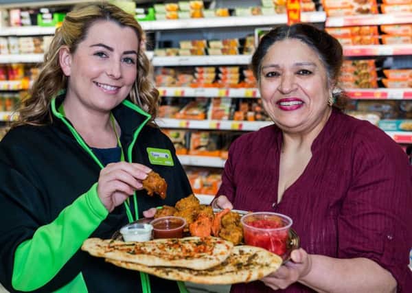 Asda Buying Assistant June Rose samples the Mrs Unis Naan Bread range. Picture: Ian Georgeson