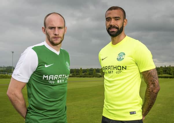Hibs defenders David Gray and Liam Fontaine model the new shirts