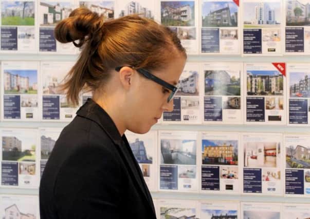 A buyer peruses the properties available in the ESPC shop in George Street. Picture: Jane Barlow