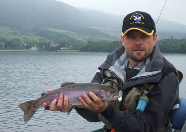 Neill Barrett of Edinburgh - main sponsor for team Scotland - with a 2lb rainbow taken on a CDC buzzer on Lake of Menteith