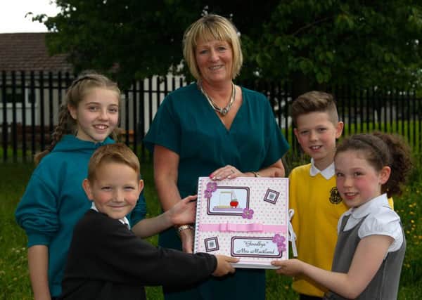 Gwen Maitland, Headteacher at Hawthornden Primary school, with Anja French and Declan Murphy on the left, and Aaron Robertson and Genevieve Keith, on her final day