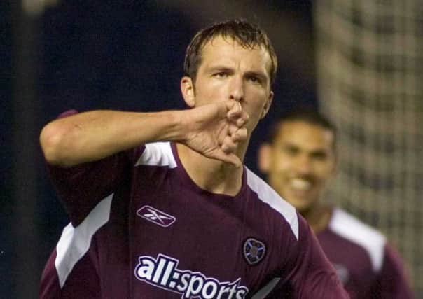 Andy Webster celebrates scoring the opener for Hearts