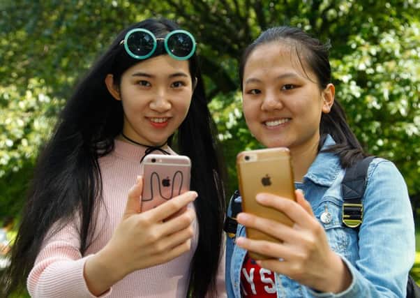 Pokemon Go players Tiffany Wong and Dasy Wei in Princes Street Garden. Picture: Scott Louden