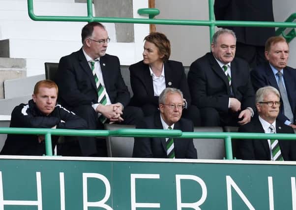 Neil Lennon, far left, watches from the directors box after being sent to the stand