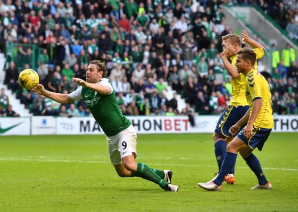 Grant Holt goes down in Brondby box, but Hibs werent awarded a spot kick. Pic: SNS