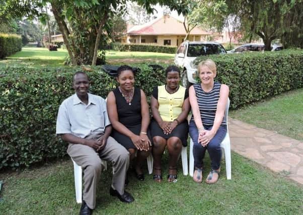 Janice Logan in Uganda with the nurses she's mentoring. Picture: contributed