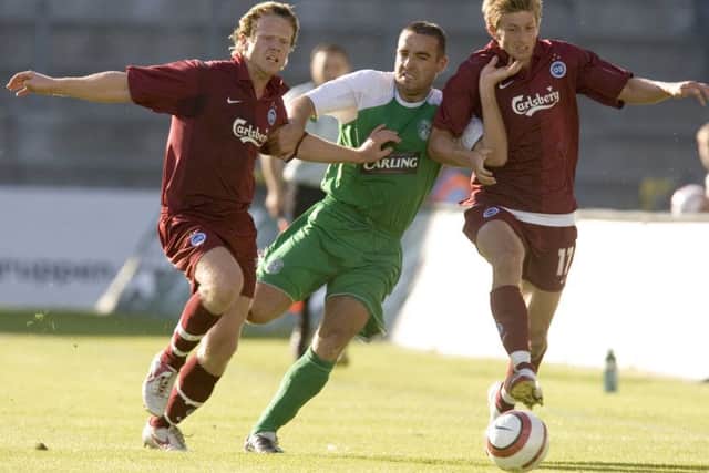 David Murphy tries to break past the Odense defence back in 2006, the last time Hibs were in Denmark. Pic: SNS