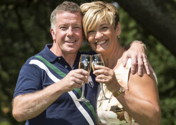 Alison and John Doherty celebrate winning Â£14,671,343. Picture: PA
