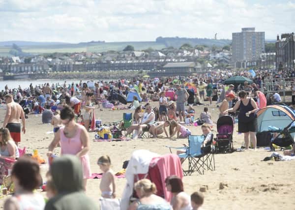 Sunseekers flock to Portobello beach on the hottest day of the year. Picture: Greg Macvean