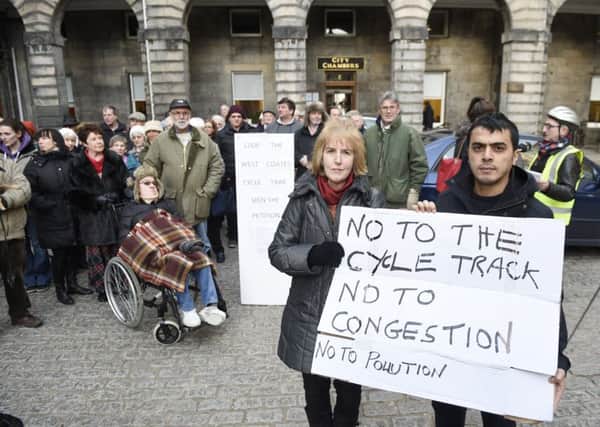 Roseburn residents Judy Probert and Sahin Katil at the City Chambers in February to protest against the plans. Picture: Greg Macvean