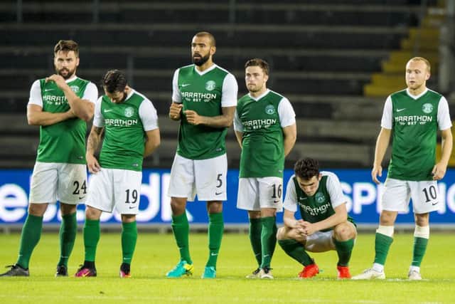 Hibs' John McGinn, second from right, can't hide his despair after he was the only player to miss a penalty in the shoot-out defeat by Brondby. Pic: SNS