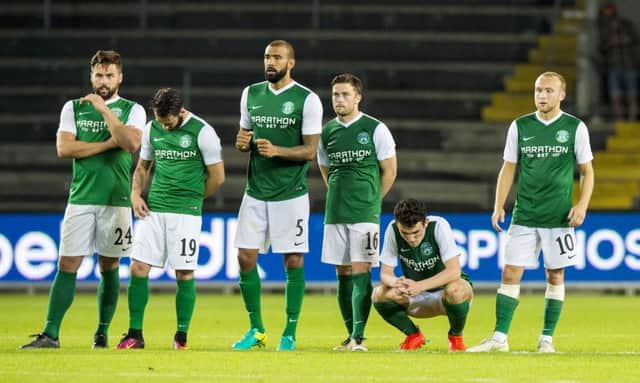 Hibs' John McGinn, second from right, can't hide his despair after he was the only player to miss a penalty in the shoot-out defeat by Brondby. Pic: SNS