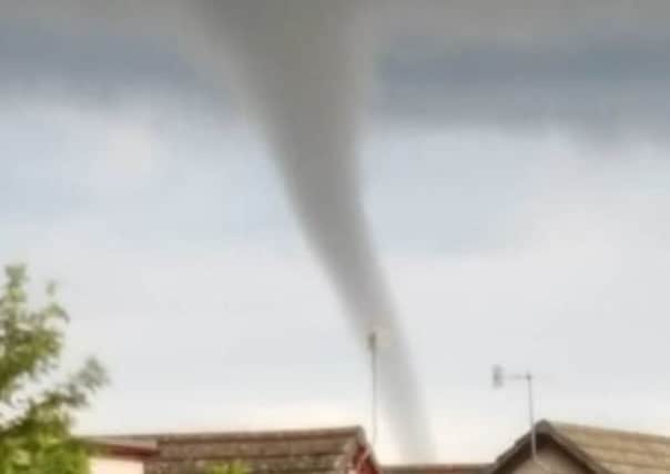 A small tornado forms over Edinburgh. Picture; Maureen Walker