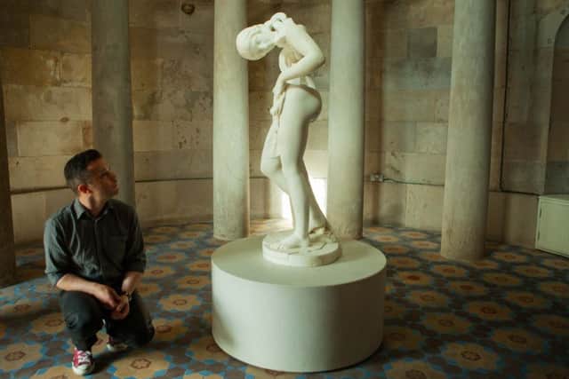 Artist Jonathan Owen with his re-carved 19th century sculpture. Picture: Toby Williams
