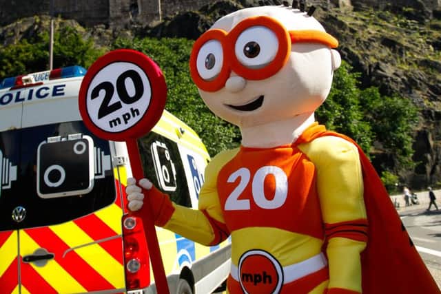 Launch of the 20mph zones in Edinburgh city centre. 20mph mascot The Reducer.