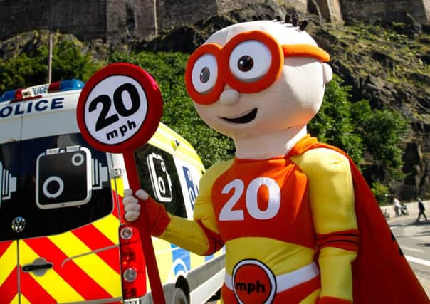 Launch of the 20mph zones in Edinburgh city centre. 20mph mascot The Reducer.