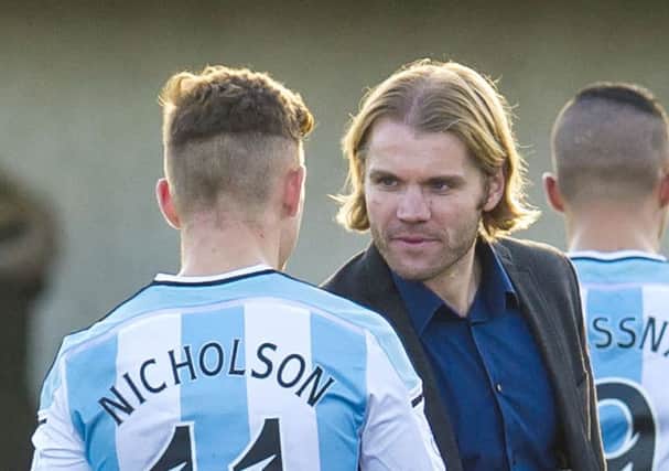 Hearts head coach Robbie Neilson says he can see Sam Nicholson's form coming back. Pic: SNS