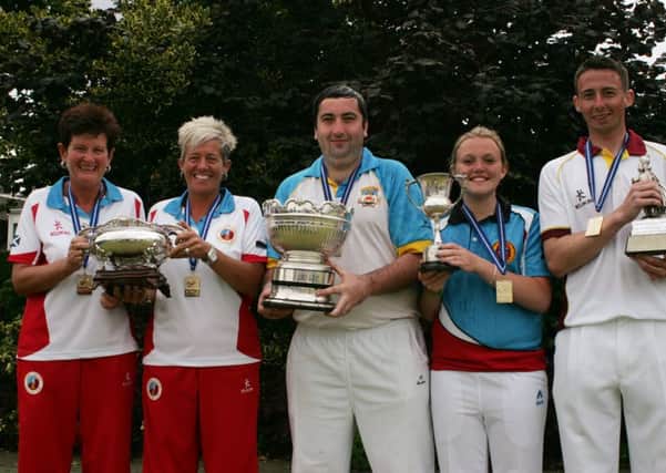 Derek Oliver, centre, with the magnificent Singles trophy and  with Sandra Steven and Kirsteen McLelland of Uphall Station, Megan Kevlin and Gordon White. Picture: Gary Clelland
