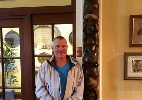 Trevor Proverbs with the totem pole in the Royal Scots Club. Picture: contributed