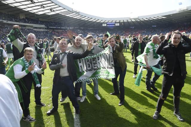 Hibs fans on the pitch after the final whistle. Picture; Greg Macvean