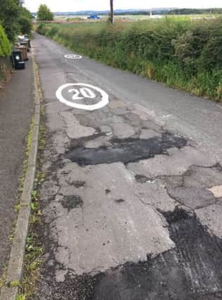 A pothole covered by a fresh 20mph sign in Edinburgh. Picture; William Imrie