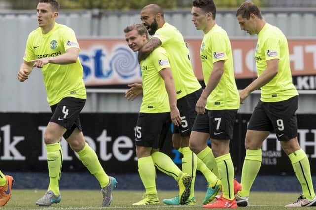John McGinn, second right, was pleased with the grit displayed by Hibs as two goals from Jason Cummings, second left, clinched victory at Falkirk